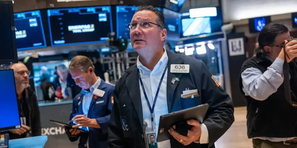 Traders actively engage on the New York Stock Exchange floor, capturing its dynamic atmosphere.